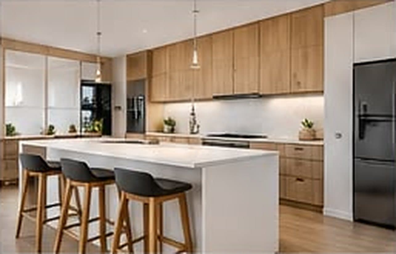 Kitchen with timber cabinetry, a stone island bench and pendant lights